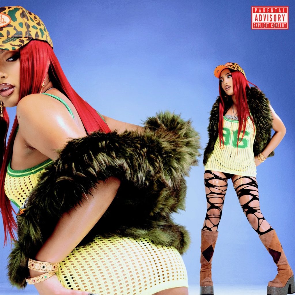 Brazen Barbie posing in a Y2K-inspired outfit with red hair and camouflage cap